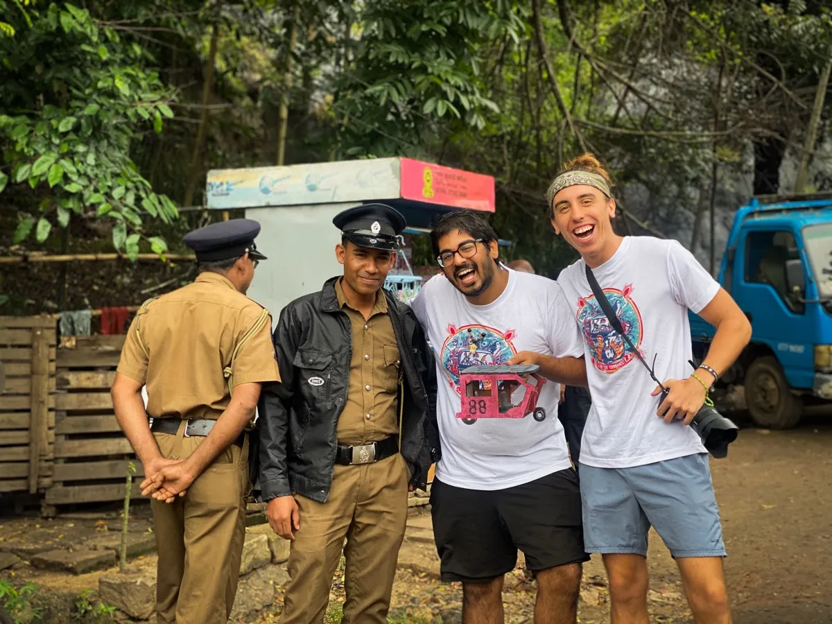 Tournament participants laughing with local Sri Lankan police